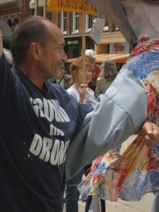 Michael Walli and the other two members of the Transform Now Plowshares joined with supporters for street theater in downtown Knoxville before walking to court for the beginning of their trial. May 6, 2013. Photo by Felice Cohen-Joppa